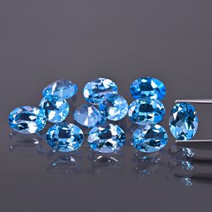 Pietra ovale, cono - topazio Swiss Blue 7x5 MM